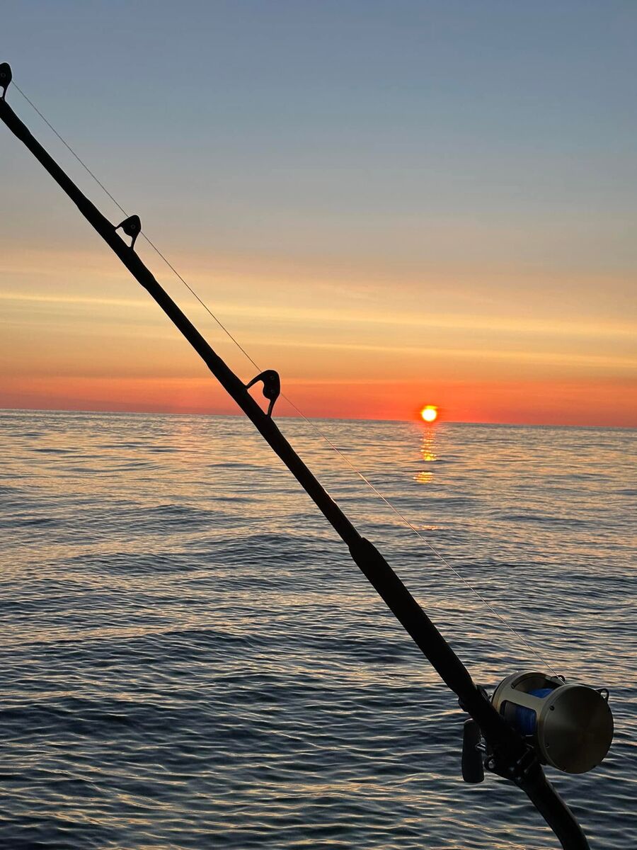 Sunset over the water at the end of a trip